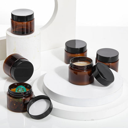 SATINIOR 24 Pieces Empty Clear Plastic Jars with Lids Round Storage Containers Wide Mouth for Beauty Product Cosmetic Cream Lotion Liquid Butter Craft and Food(Amber Lid,2 oz)