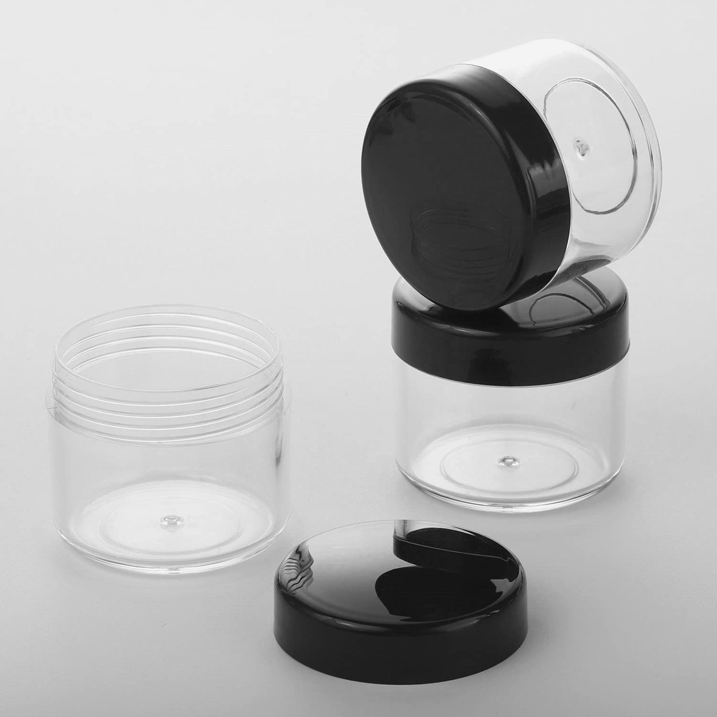 Refillable Cosmetic Sample Jars - 100 Pack 20g (0.7oz) Black Small Travel Containers with Lids + 10 Mini Makeup Spatulas - BPA Free